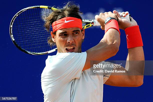 Rafael Nadal of Spain returns the ball against Benoit Paire of France during day five of the 2013 Barcelona Open Banc Sabadell on April 26, 2013 in...