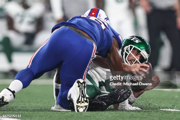 Aaron Rodgers of the New York Jets reacts as he sacked by Leonard Floyd of the Buffalo Bills during a game at MetLife Stadium on September 11, 2023...