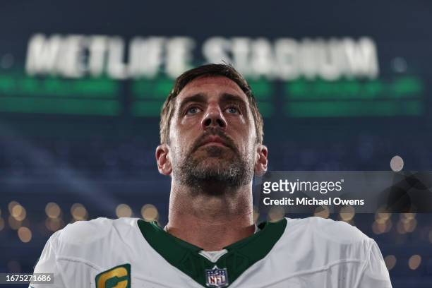 Aaron Rodgers of the New York Jets looks on during the national anthem prior to a game against the Buffalo Bills at MetLife Stadium on September 11,...