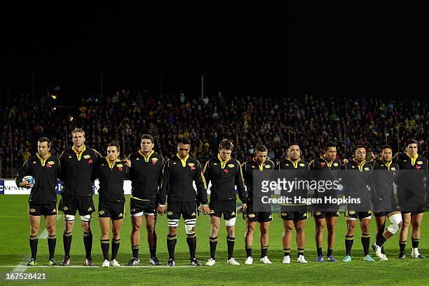Hurricanes players observe a moment of silence to commemorate the ANZACs during the round 11 Super Rugby match between the Hurricanes and the...