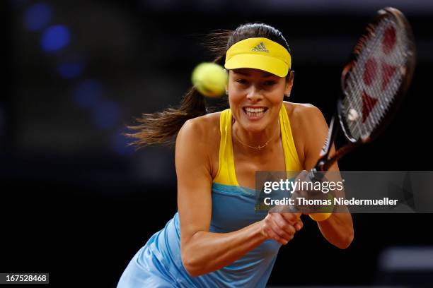 Ana Ivanovic of Serbia returns the ball to Maria Sharapova of Russia during Day 5 of the Porsche Tennis Grand Prix at at Porsche-Arena on April 26,...