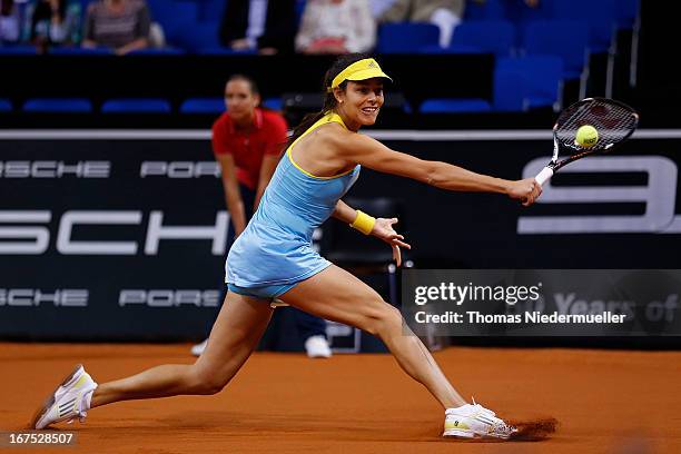 Ana Ivanovic of Serbiareturns the ball to Maria Sharapova of Russia during Day 5 of the Porsche Tennis Grand Prix at at Porsche-Arena on April 26,...