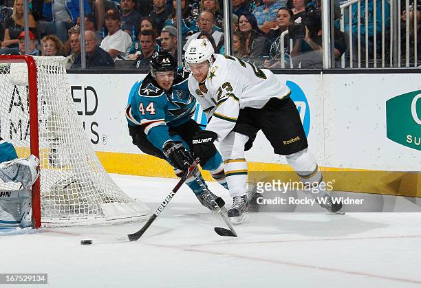 Marc-Edouard Vlasic of the San Jose Sharks and Tom Wandell of the Dallas Stars battle for the puck at the HP Pavilion on April 23, 2013 in San Jose,...