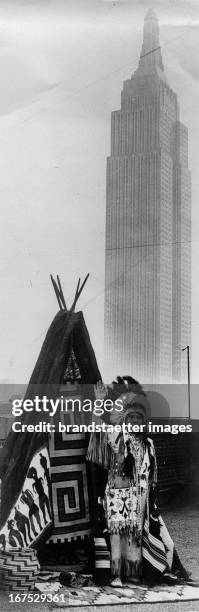 Red Wing ; a girl from the tribe of Winnebago Indians visited New York. In the background the Empire State Building. . USA. Photograph. Red Wing ;...