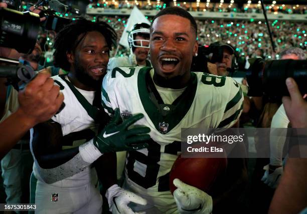 Xavier Gipson of the New York Jets celebrates his game winning touchdown with teammate Michael Carter II of the New York Jets after the overtime win...