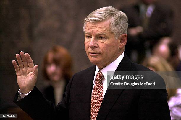 University of Massachusetts President William Bulger, brother of fugitive Boston mobster James "Whitey" Bulger, is sworn in before a congressional...