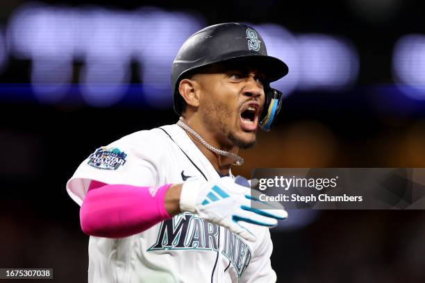 Julio Rodriguez of the Seattle Mariners celebrates his two run home run during the tenth inning against the Los Angeles Angels at T-Mobile Park on...