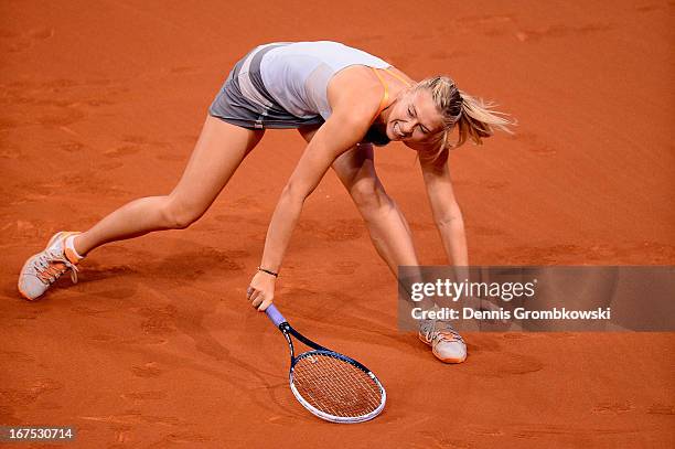 Maria Sharapova of Russia reacts during her match against Ana Ivanovic of Serbia during Day 5 of the Porsche Tennis Grand Prix at Porsche-Arena on...