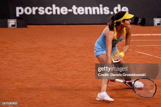 Ana Ivanovic of Serbia plays a forehand in her match against Maria Sharapova of Russia during Day 5 of the Porsche Tennis Grand Prix at Porsche-Arena...