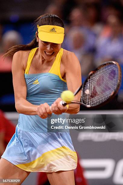 Ana Ivanovic of Serbia plays a backhand in her match against Maria Sharapova of Russia during Day 5 of the Porsche Tennis Grand Prix at Porsche-Arena...