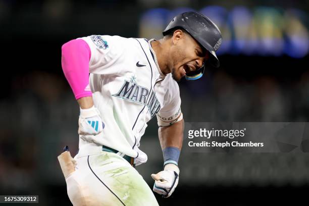 Julio Rodriguez of the Seattle Mariners celebrates his two run home run during the tenth inning against the Los Angeles Angels at T-Mobile Park on...