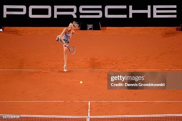 Maria Sharapova of Russia serves in her match against Ana Ivanovic of Serbia during Day 5 of the Porsche Tennis Grand Prix at Porsche-Arena on April...