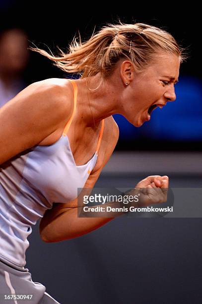 Maria Sharapova of Russia reacts during her match against Ana Ivanovic of Serbia during Day 5 of the Porsche Tennis Grand Prix at Porsche-Arena on...