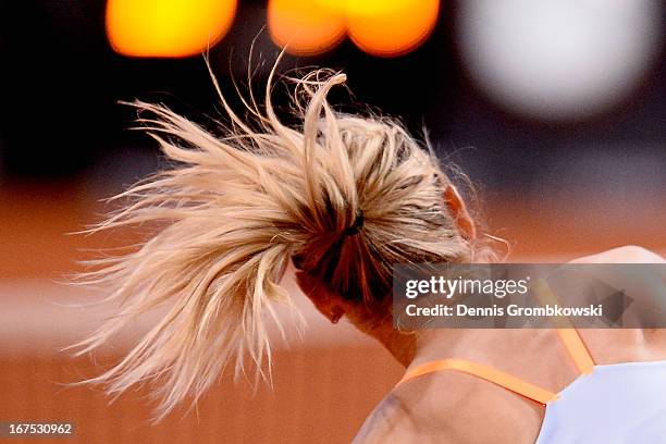 Maria Sharapova of Russia serves in her match against Ana Ivanovic of Serbia during Day 5 of the Porsche Tennis Grand Prix at Porsche-Arena on April...