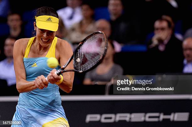 Ana Ivanovic of Serbia plays a backhand in her match against Maria Sharapova of Russia during Day 5 of the Porsche Tennis Grand Prix at Porsche-Arena...