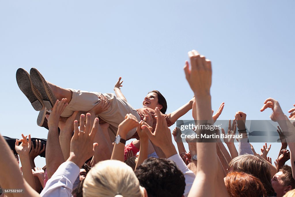 Woman crowd surfing