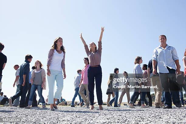 crowd of walking people - crowd looking up stock pictures, royalty-free photos & images