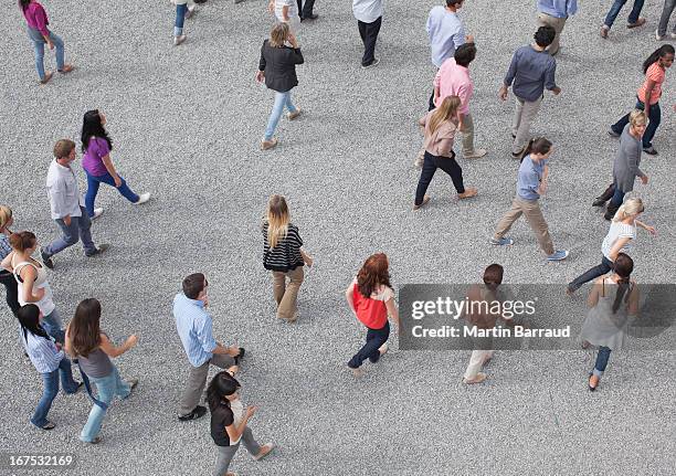 crowd of walking people - crowd anticipation stock pictures, royalty-free photos & images