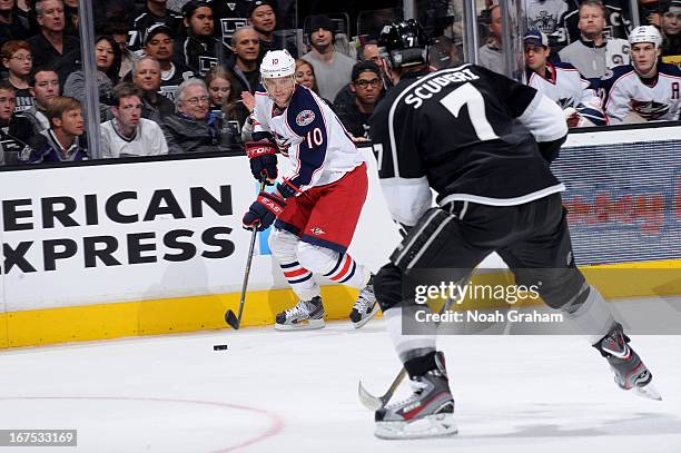 Marian Gaborik of the Columbus Blue Jackets skates with the puck against Rob Scuderi of the Los Angeles Kings at Staples Center on April 18, 2013 in...