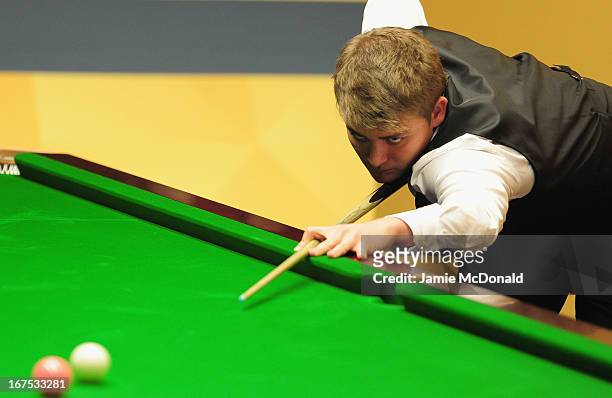 Michael White in action during his second round match against Dechawat Poomjaeng during the Betfair World Snooker Championship at the Crucible...