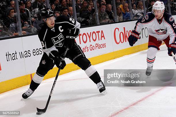 Dustin Brown of the Los Angeles Kings skates with the puck against the Columbus Blue Jackets at Staples Center on April 18, 2013 in Los Angeles,...