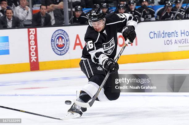 Slava Voynov of the Los Angeles Kings skates with the puck against the Columbus Blue Jackets at Staples Center on April 18, 2013 in Los Angeles,...