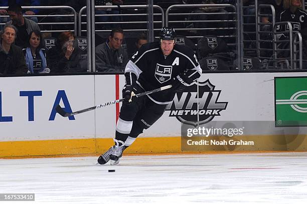 Matt Greene of the Los Angeles Kings skates with the puck against the Columbus Blue Jackets at Staples Center on April 18, 2013 in Los Angeles,...
