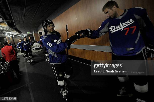 Drew Doughty and Jeff Carter of the Los Angeles Kings prepare to take the ice to warm up prior to the game against the Columbus Blue Jackets at...