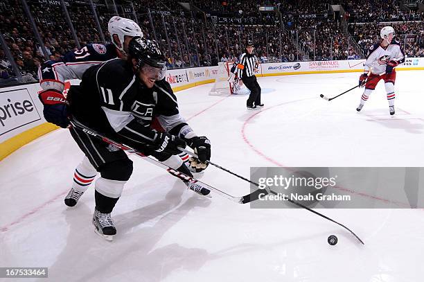 Anze Kopitar of the Los Angeles Kings skates with the puck against Fedor Tyutin of the Columbus Blue Jackets at Staples Center on April 18, 2013 in...