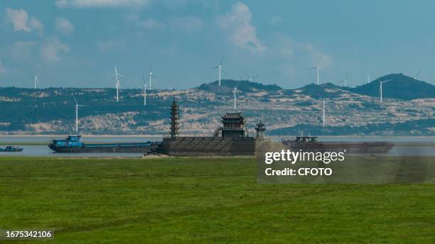 The Luoxing Pier of Millennium Stone Island emerges from the bottom of Poyang Lake as the water level in Poyang Lake enters a low dry period in...