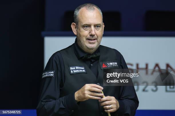 Mark Williams of Wales chalks the cue in the first round match against Pang Junxu of China on day 2 of World Snooker Shanghai Masters 2023 at...