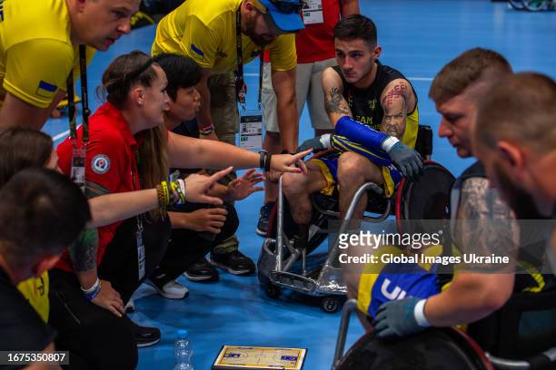 Competitors of the Team Unconquered consult with trainers and prepare for the Mixed Team Wheelchair Rugby match with Team Italy during day one of the...