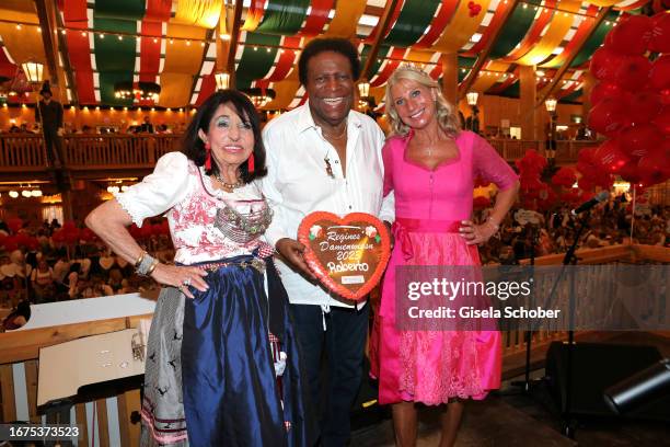 Regine Sixt, Roberto Blanco and Karin Baumueller-Soeder attend the Regine's Damenwiesn at Schützen-Festzelt Theresienwiese on September 18, 2023 in...