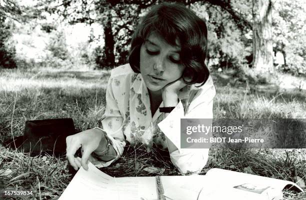 Actress Anne Wiazemsky studies a philosophy book between shots on the set of the film "Au Hasard Balthazar" by Robert Bresson on September 22, 1965...