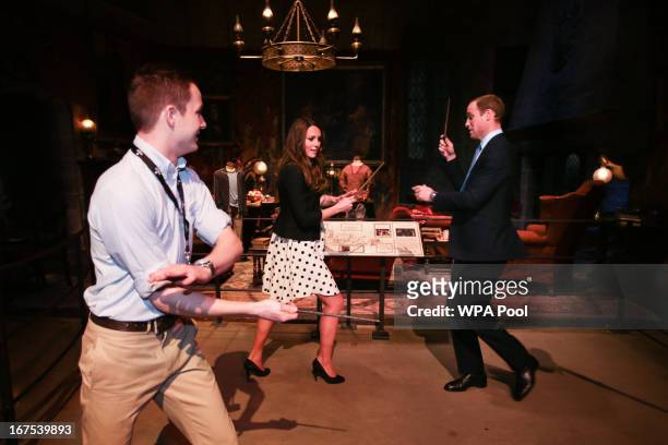 Catherine, Duchess of Cambridge and Prince William, Duke of Cambridge pretend to challenge each other with their wands during the Inauguration Of...