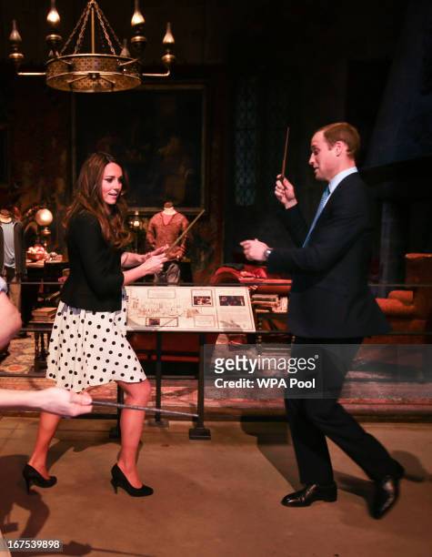 Catherine, Duchess of Cambridge and Prince William, Duke of Cambridge pretend to challenge each other with their wands during the Inauguration Of...