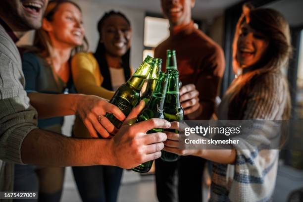 cheers to us all! - beer bottle stock pictures, royalty-free photos & images