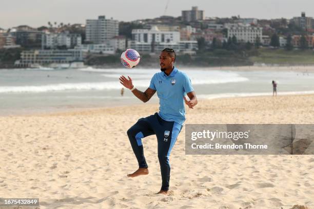 Sydney FC new signing, Fabio Gomes juggles a football on Bondi Beach during a Sydney FC A-League Mens player signing announcement at Bondi Beach on...