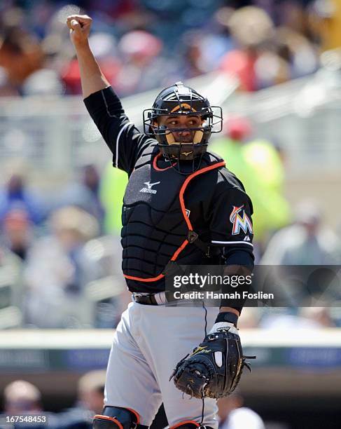 Miguel Olivo of the Miami Marlins shows signs while catching against the Minnesota Twins during the first game of a doubleheader on April 23, 2013 at...