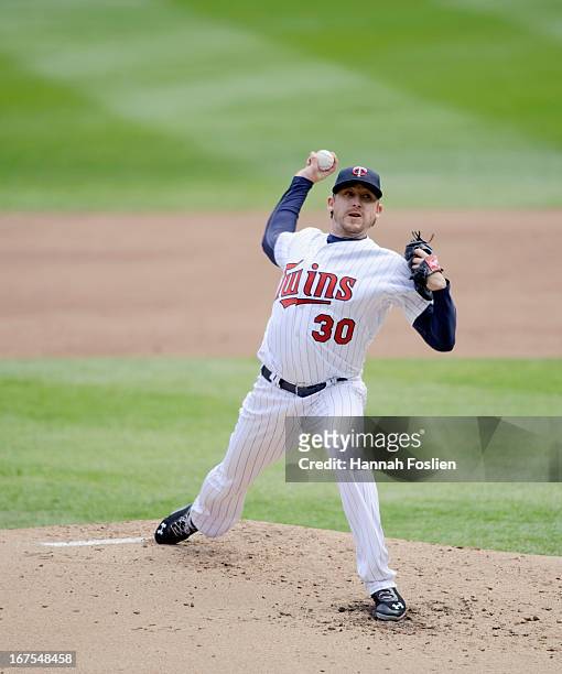 Kevin Correia of the Minnesota Twins delivers a catch against the Miami Marlins during the first game of a doubleheader on April 23, 2013 at Target...