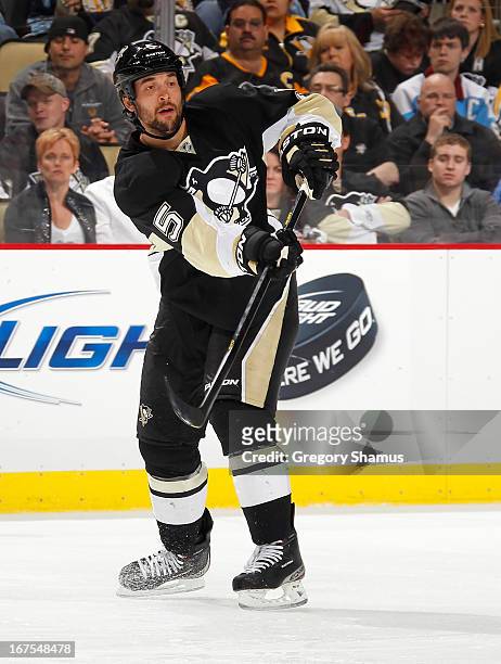 Deryk Engelland of the Pittsburgh Penguins moves the puck against the Buffalo Sabres on April 23, 2013 at Consol Energy Center in Pittsburgh,...