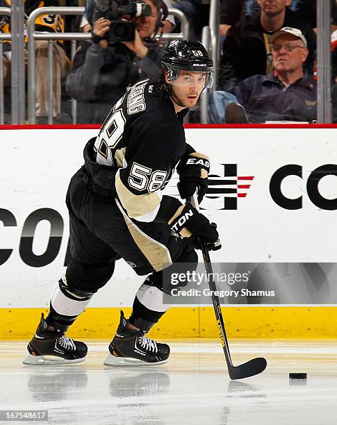 Kris Letang of the Pittsburgh Penguins moves the puck against the Buffalo Sabres on April 23, 2013 at Consol Energy Center in Pittsburgh,...