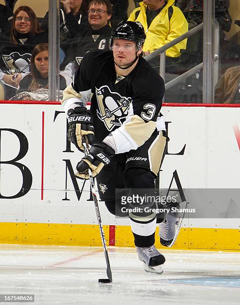 Douglas Murray of the Pittsburgh Penguins moves the puck against the Buffalo Sabres on April 23, 2013 at Consol Energy Center in Pittsburgh,...