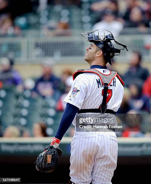 Joe Mauer of the Minnesota Twins chases down a foul ball during the first game of a doubleheader against the Miami Marlins on April 23, 2013 at...