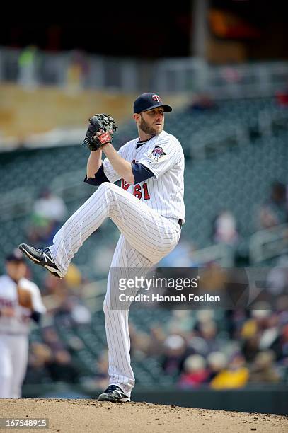 Jared Burton of the Minnesota Twins delivers a pitch against the Miami Marlins during the first game of a doubleheader on April 23, 2013 at Target...