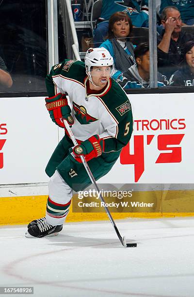 Brett Clark of the Minnesota Wild skates with the puck against the San Jose Sharks at the HP Pavilion on April 18, 2013 in San Jose, California. The...