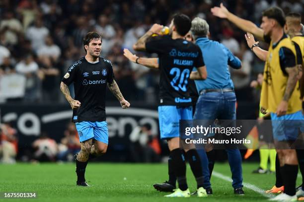 Nathan of Gremio celebrates with teammates after scoring the team's first goal during a match between Corinthians and Gremio as part of Brasileirao...