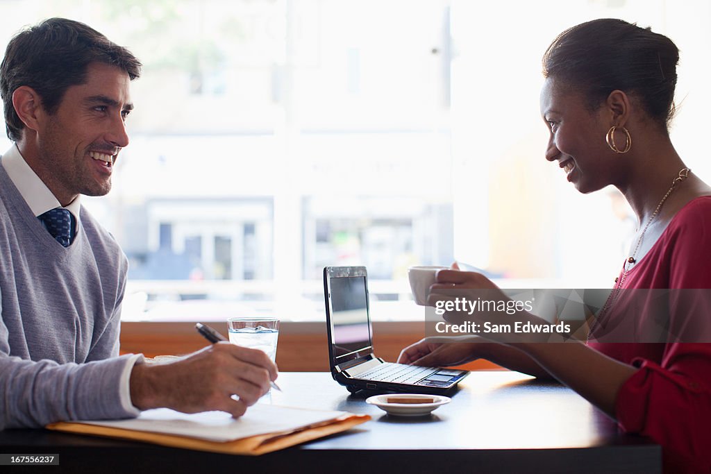 Businesswoman working in cafe