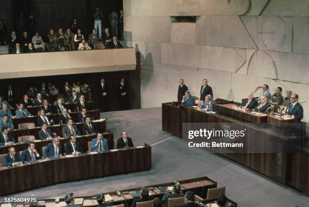 Egyptian President Anwar Sadat addressing members of the Knesset during a visit to Tel Aviv, Israel, November 20th 1977. To his right are Yitzhak...