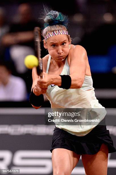 Bethanie Mattek-Sands of the United States plays a backhand in her match against Sabine Lisicki of Germany during Day 5 of the Porsche Tennis Grand...